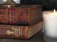 Book and candle Antique books and sweet-scented candles create a charming bedside display.