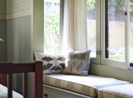 CB-0910-Keyes-14 Be inspired by this cozy retreat. With calm colors, soft fabrics and comfortable cushions, this window seat is the perfect spot for gift-list writing and resting of weary shopper's feet.
