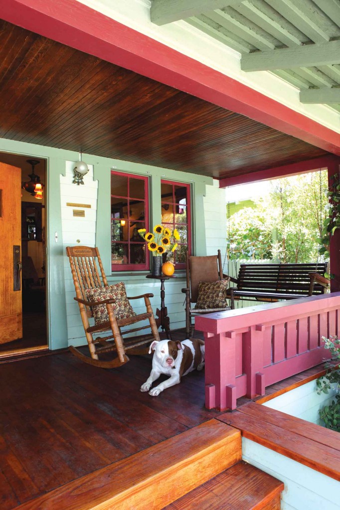 dog relaxes on the classic Craftsman porch