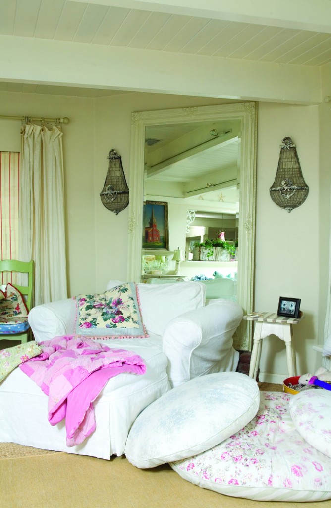overstuffed club chair and ottoman paired with a large mirror overstuffed club chair and ottoman paired with a large mirror