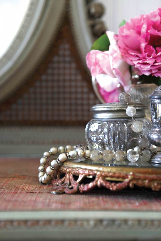 Display jewelry and fresh flowers on a vanity Display jewelry and fresh flowers on a vanity