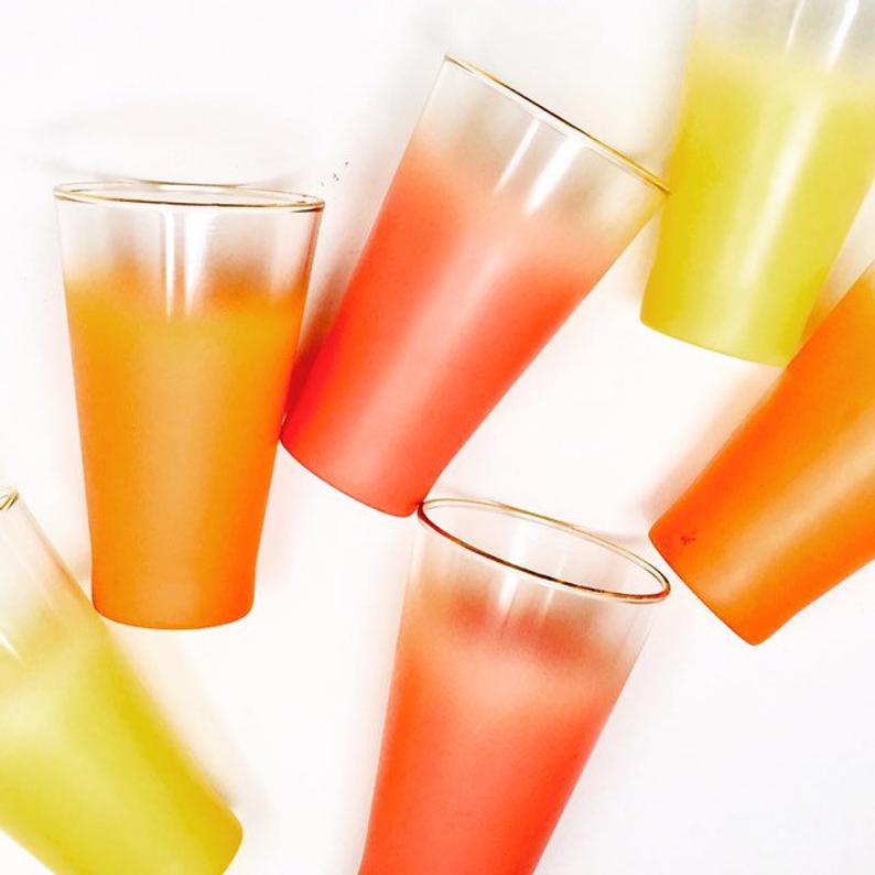 Gold rimmed Blendo colorful tumbler glasses. 