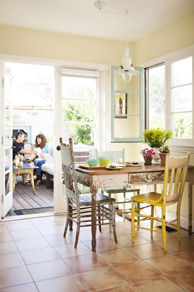 look through a historic Spanish-style kitchen out to the patio