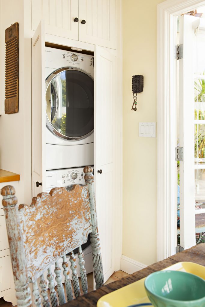 A concealed washer-dryer unit keeps the kitchen looking historic