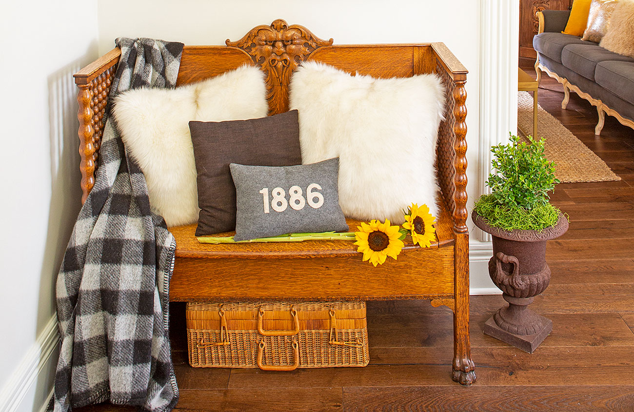 Quarter sawn victorian oak bench with pillows and sunflowers