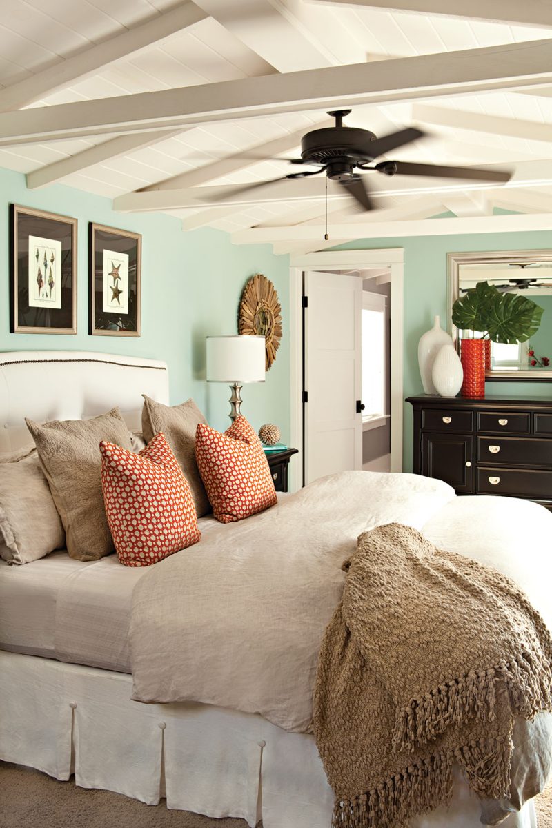 Cottage master bedroom decor with robin's egg blue and coral red color palette for patriotic cottage decor