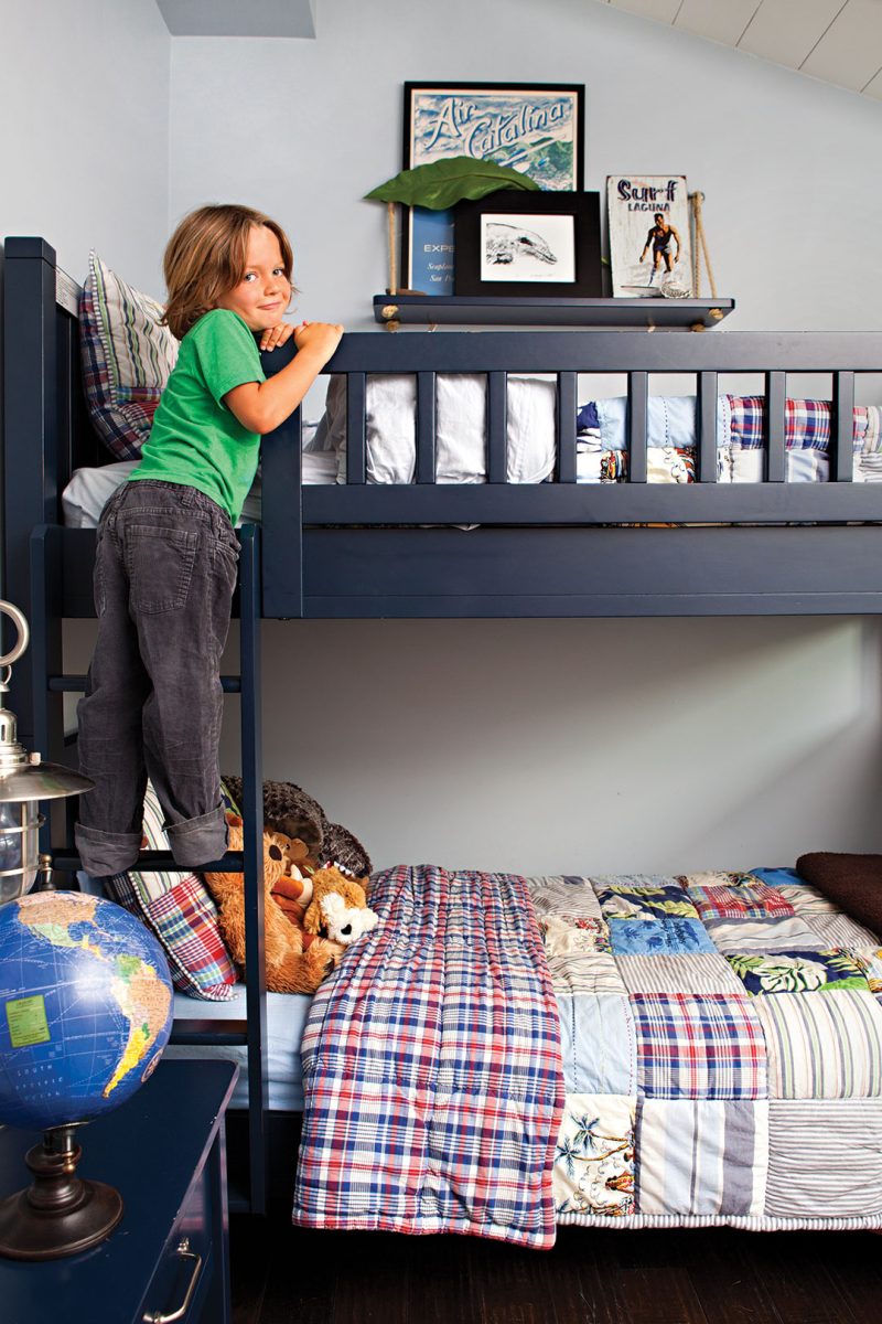 Boy's bedroom decor with navy blue bunk bed and plaid sheets
