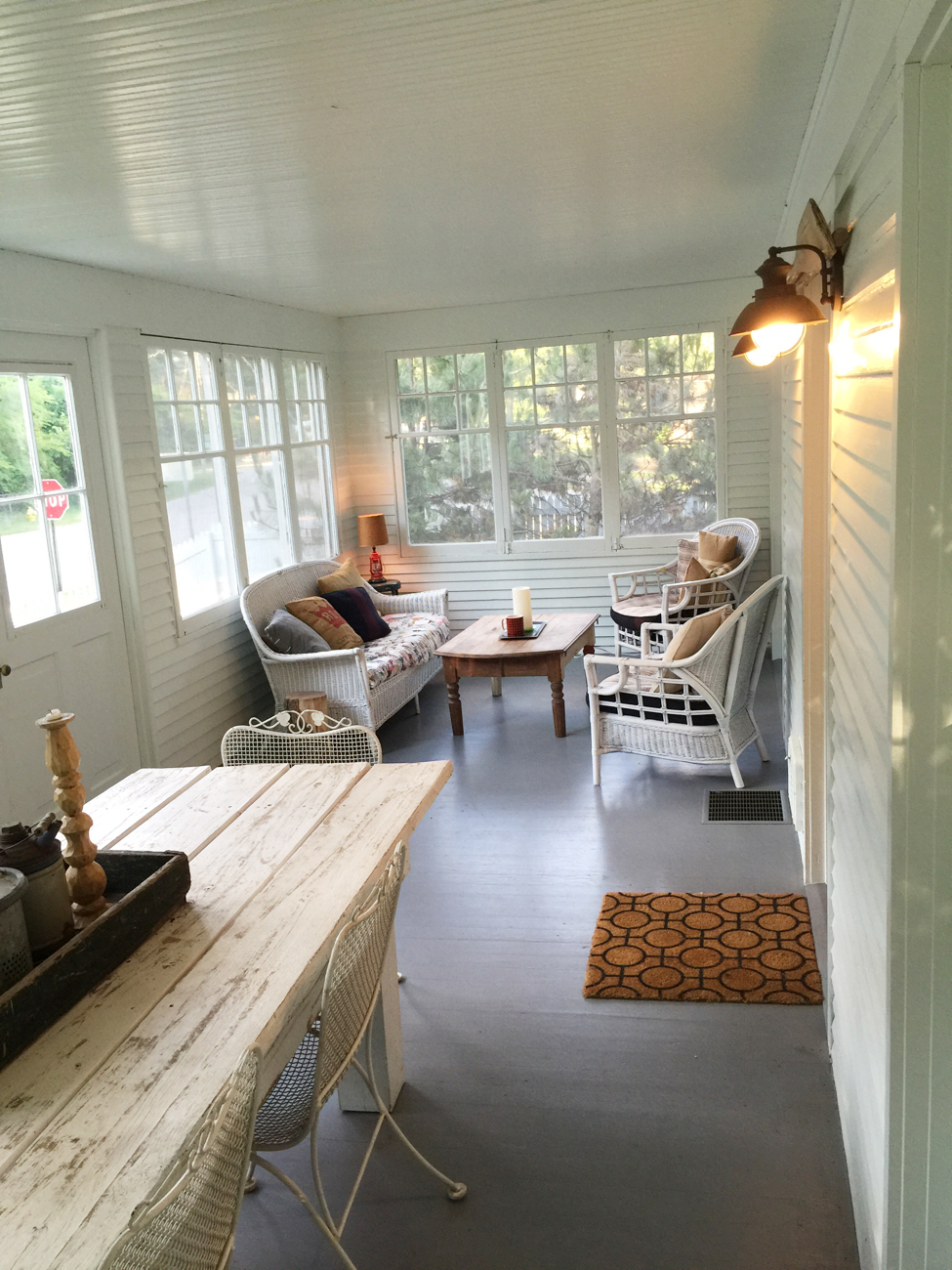 Sunroom with sitting area and dining table.