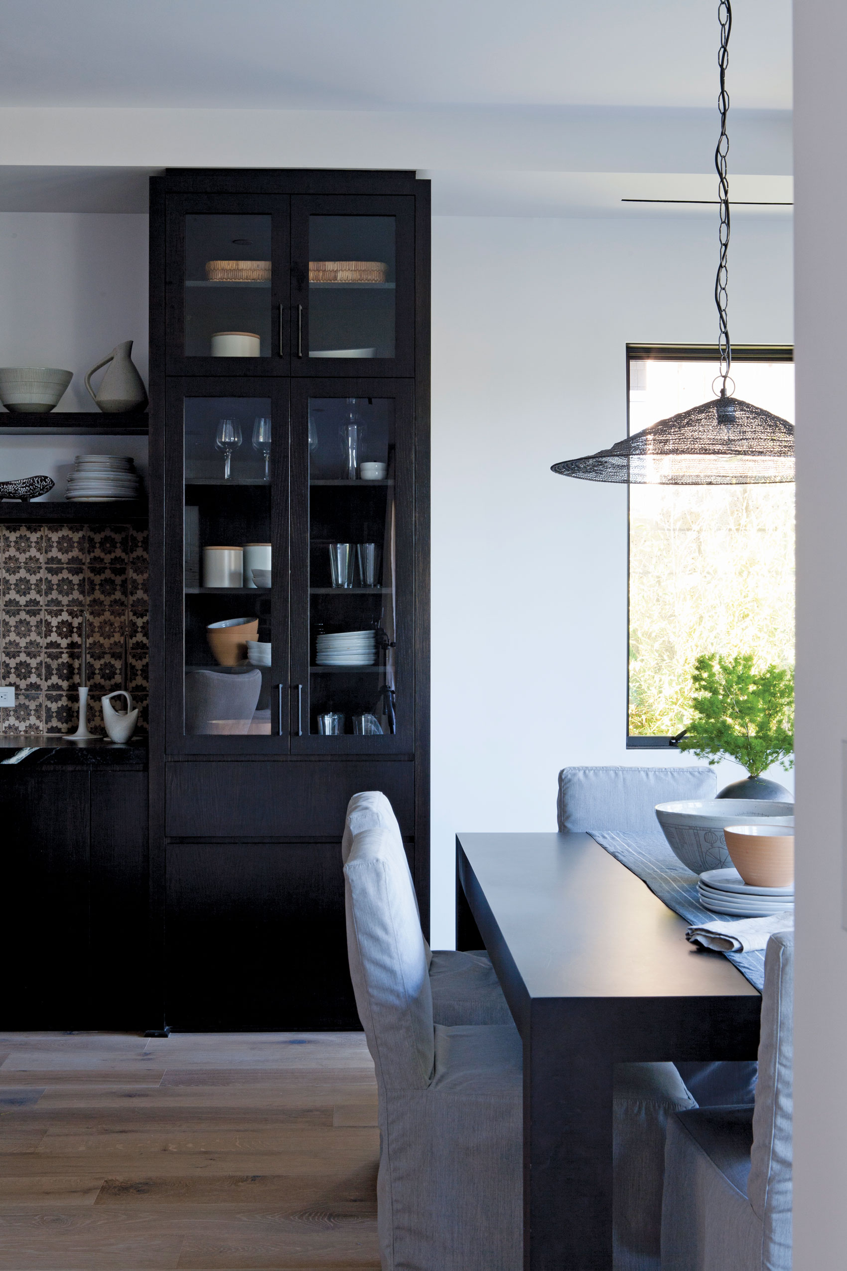 Bright Kitchen with dark accents in dining room