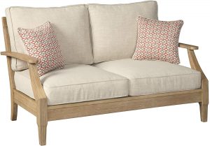 cottage patio loves seat with cream linen cushions and teak frame