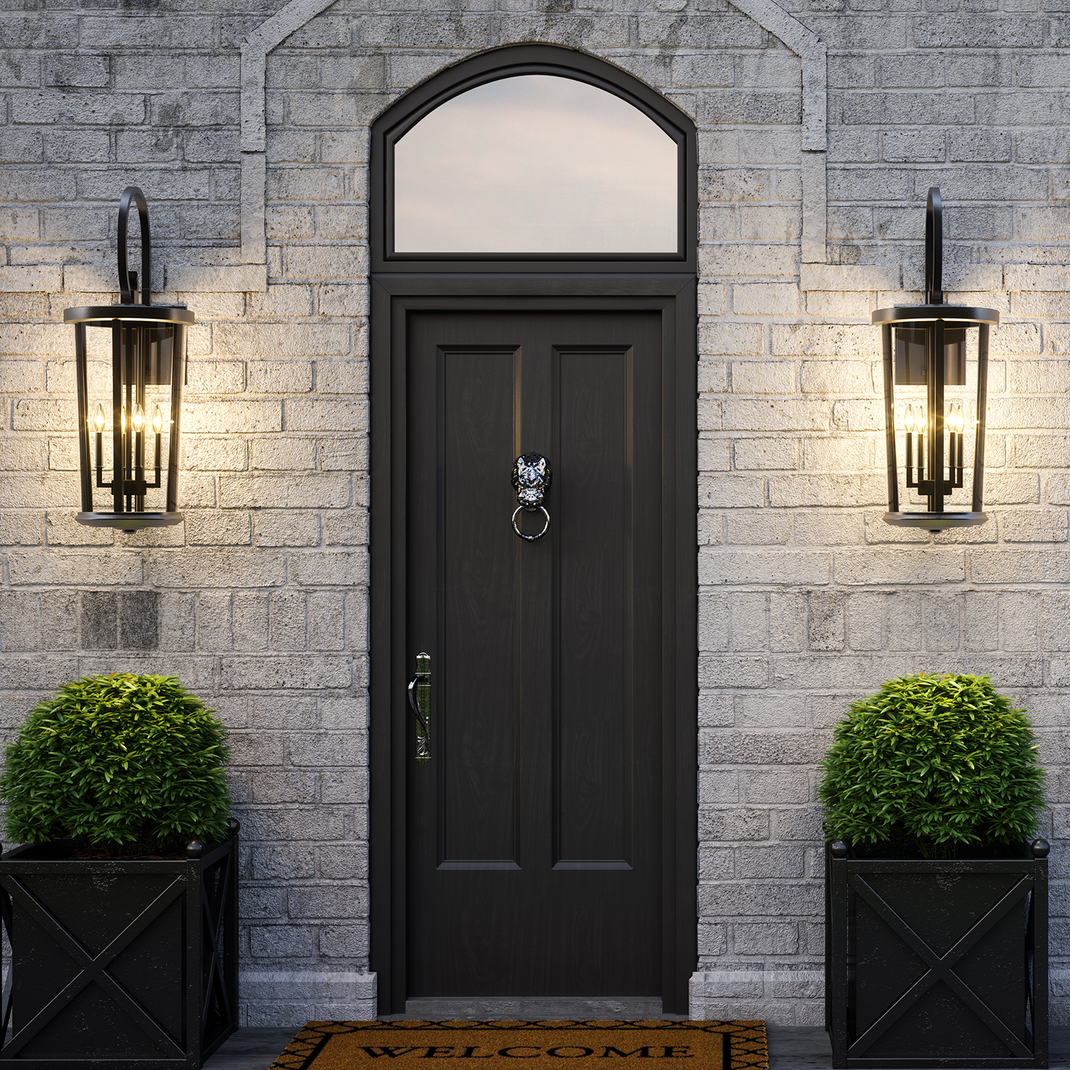 Ellsworth Lanterns lit and hanging beside the front door of a contemporary brick home