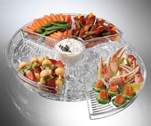 clear plastic appetizer tray with 4 compartments each with a seperate lid. The circluar tray cotains a bottom compartment where ice can be placed.