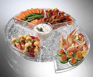 clear plastic appetizer tray with 4 compartments each with a seperate lid. The circluar tray cotains a bottom compartment where ice can be placed.