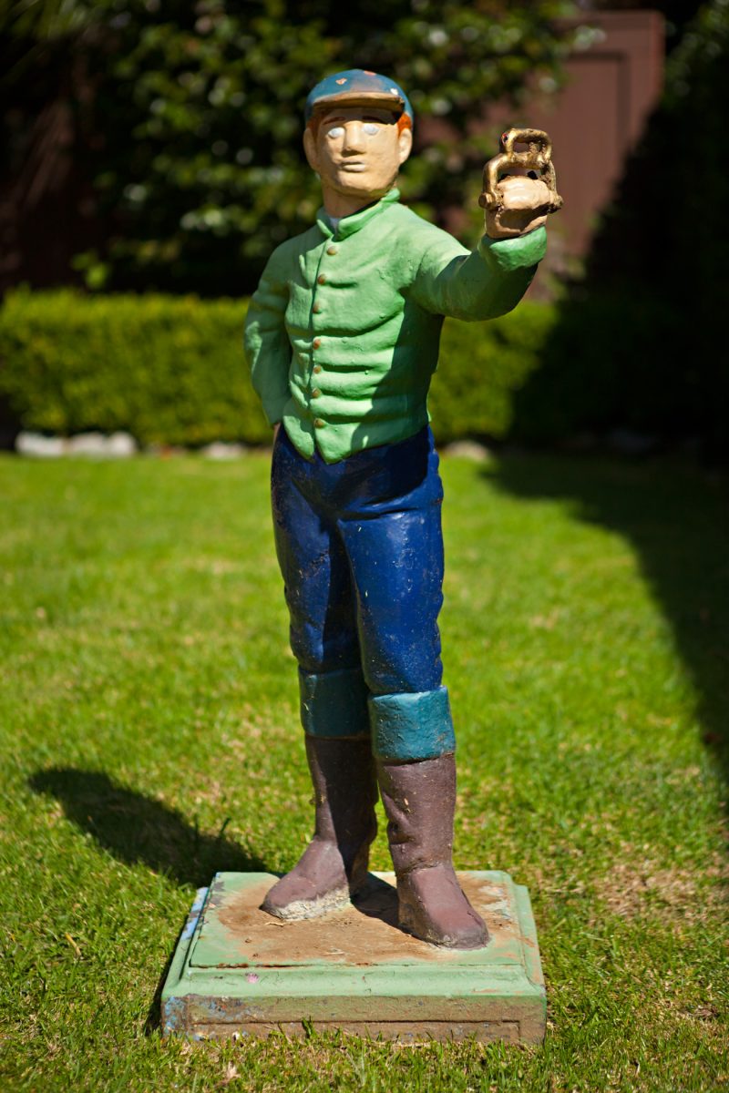 Cute lawn ornament in front yard of cape cod style cottage in southern california
