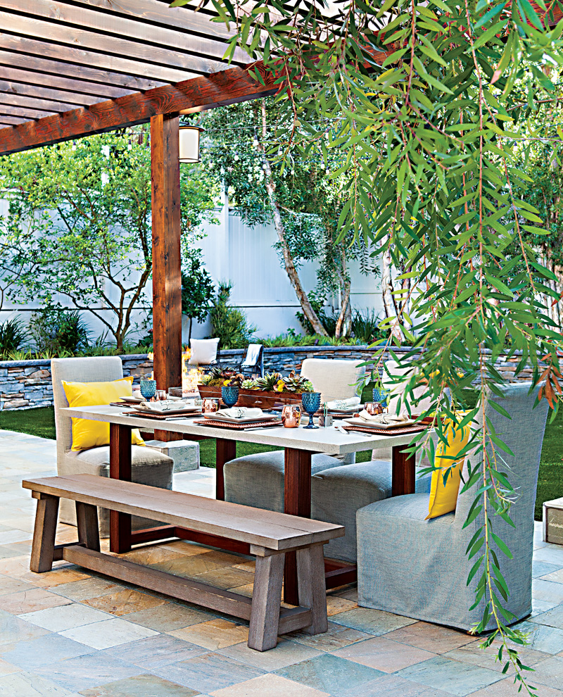 Patio dining table with blue and yellow accents