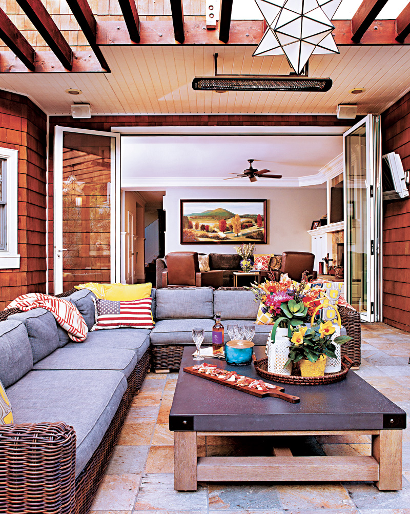 Covered patio area with outdoor tile and an outdoor couch