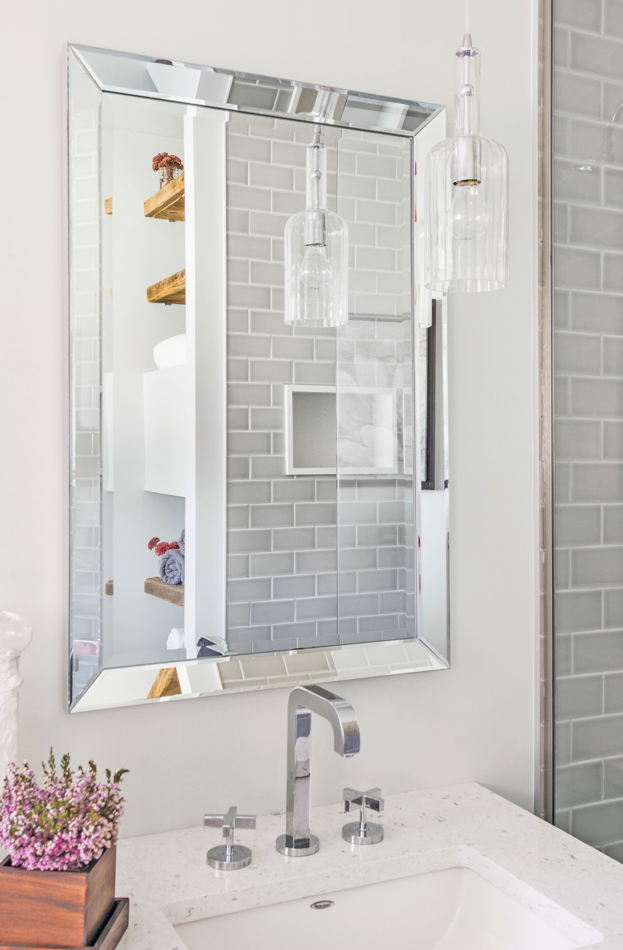 modern hanging light pendants in rustic bathroom