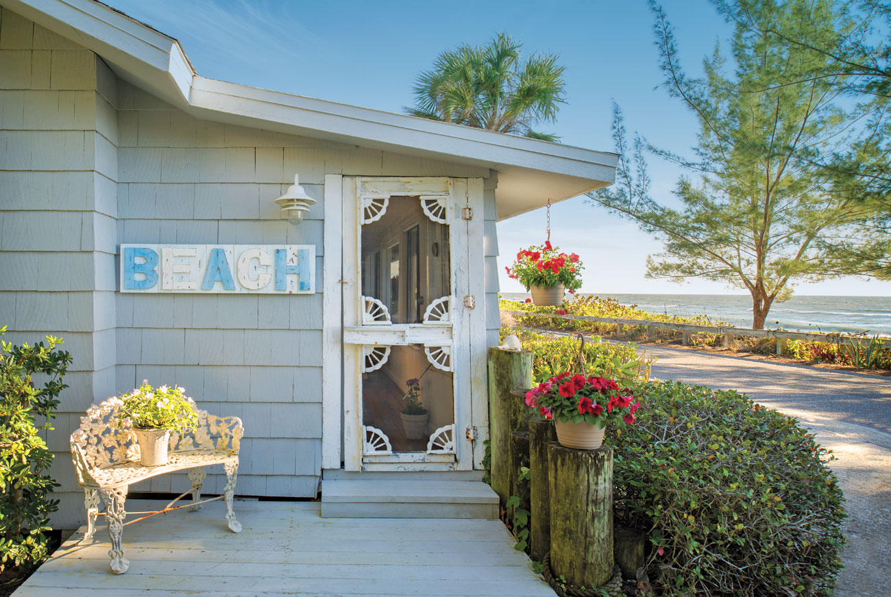 Beach bungalow entrance with front porch and intricate details