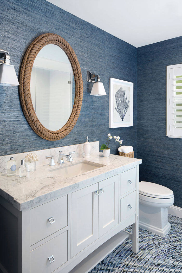 dark blue grasscloth wallpaper in renovated bathroom