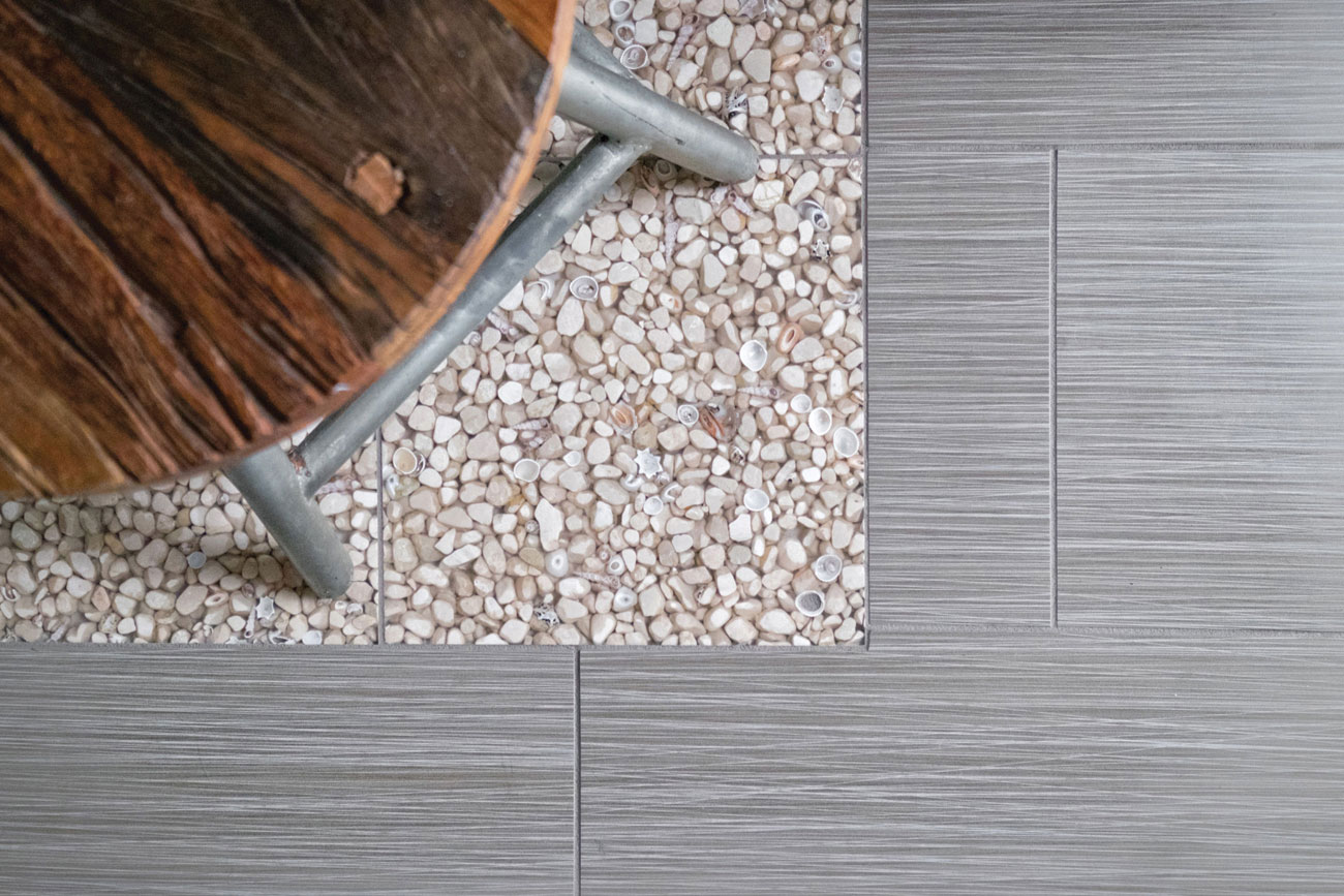 seashell flooring in modern coastal bathroom