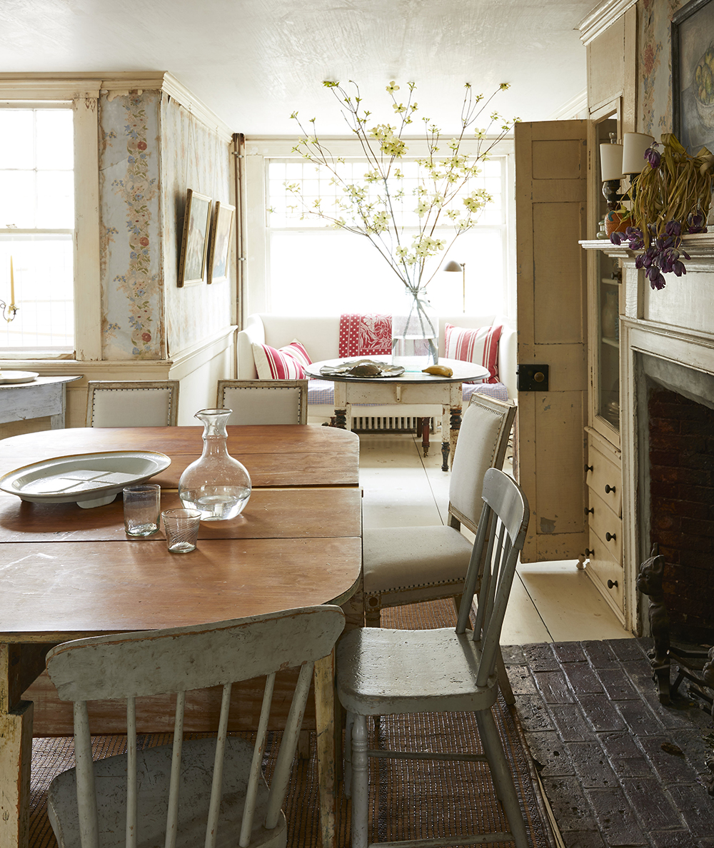 The 18th-century cape house located in Provincetown is a trove of treasures old and new. The original peeling wallpaper is surrounded by classic cottage furnishings, making it seem much more delightful than dilapidated. 