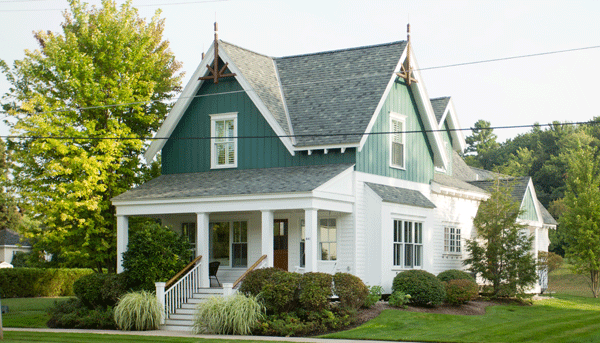 The Harbor Cottages in downtown Harbor Springs, Michigan feature homes built by The Cottage Company, and offer a sustainable, period sensitive design.
