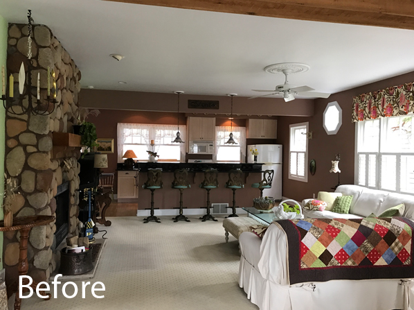 Cottage living room with stone fireplace.