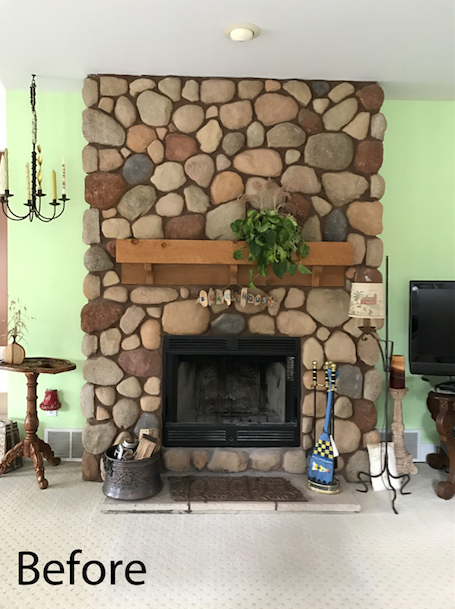 Stone fireplace in Michigan cottage living room.