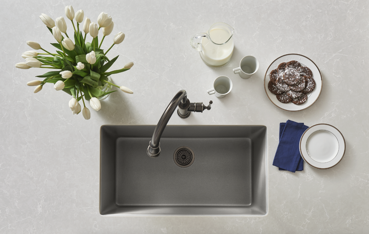 The Elkay Quartz Luxe Single Bowl Sink, shown here in Silvermist, boasts superior strength and function. These sinks are made from natural quartz and UV-stable acrylic resins, with additional organic fibers molded into the sink for added impact resistance. 