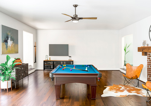 SIGNAL WITH LED LIGHT 54 INCH by Hunter Fan, shown here in a midcentury modern-style game room.