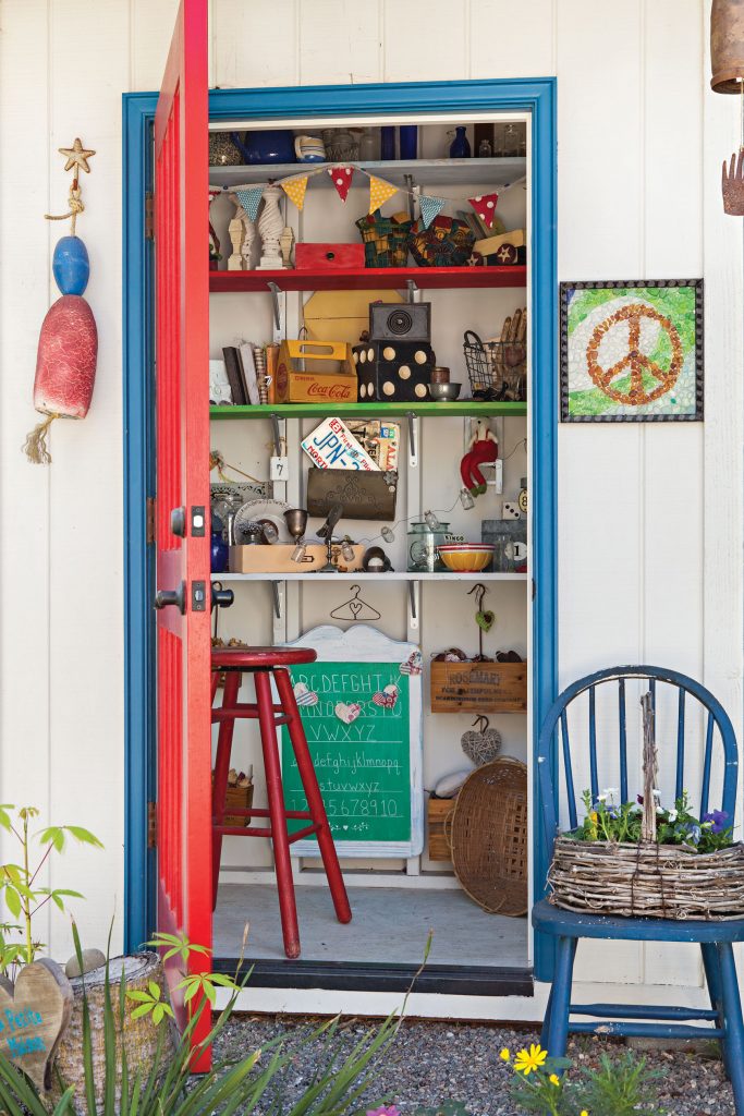 Garden shed filled with collection of knickknacks and treasures.