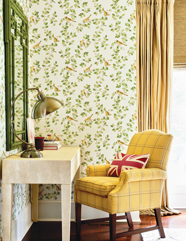 Desk area of guest bedroom with yellow accent chair.