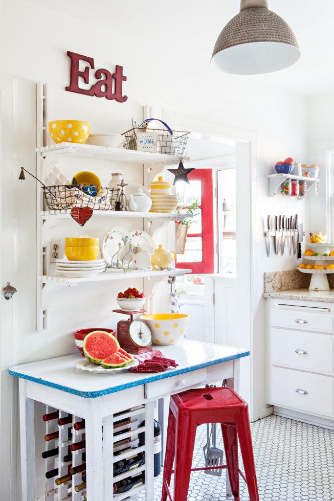 Small kitchen full of creative vintage storage and organization.