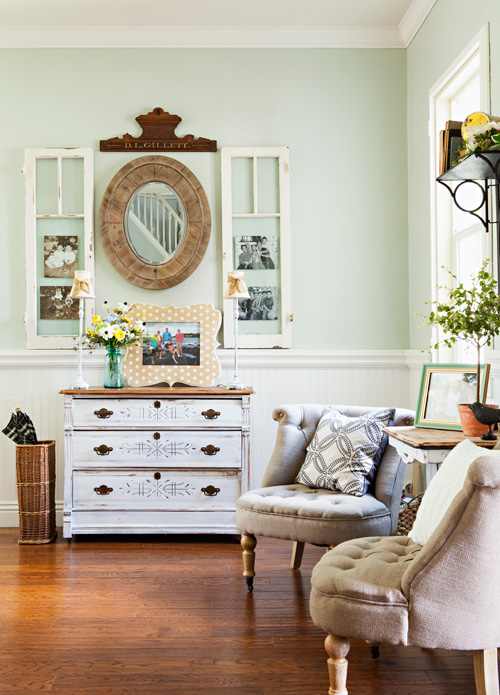 Give your new space vintage architectural and design appeal by repurposing salvaged materials. Using old windows as photo frames is a great way to create a focal point, shown here.