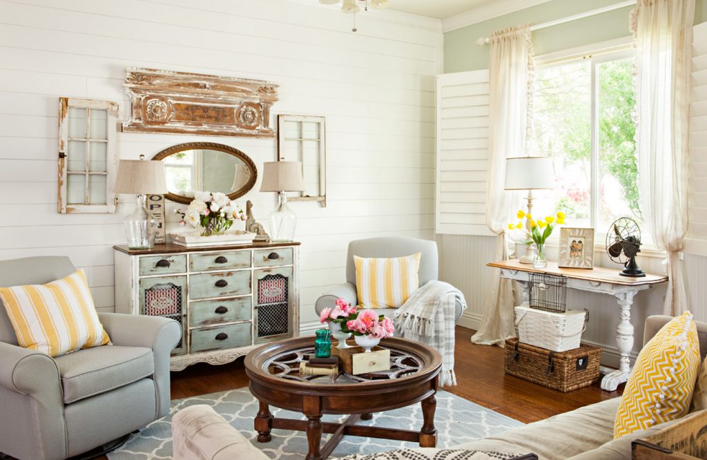 Cozy living room with light blue and yellow accents and repurposed wood elements.