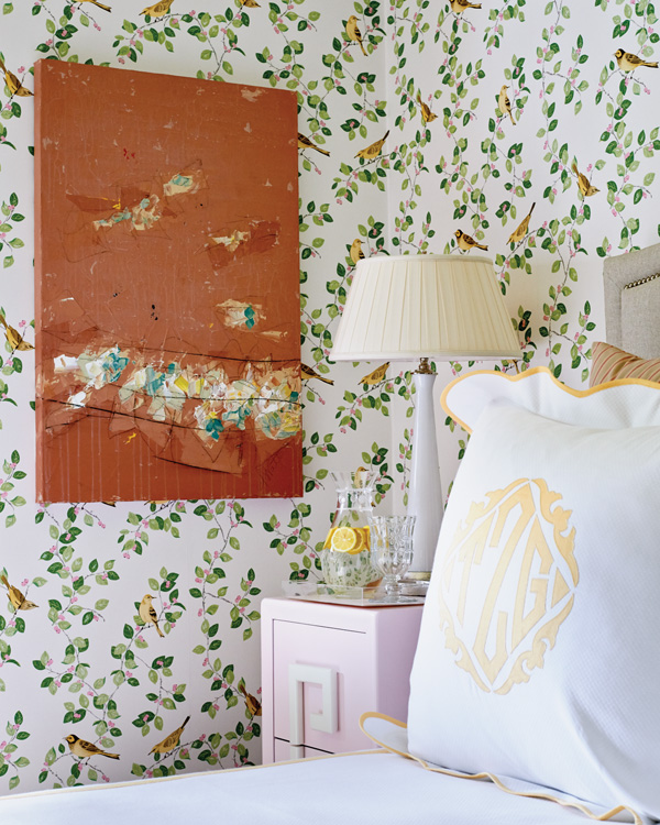 Guest bedroom corner featuring monogrammed pillow.