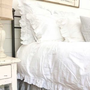 white ruffled bedding set
