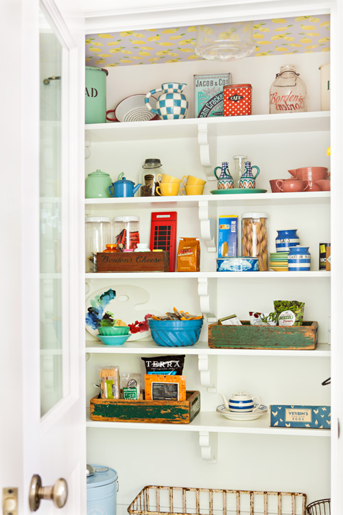 This cottage pantry is filled with vintage treasures that have been repurposed in new ways to make the most of the small space.