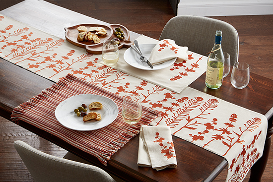 A warm tablescape created by using the Nature Embroidered Table Runner and Aston Stripe Table Placements from the Company Store.