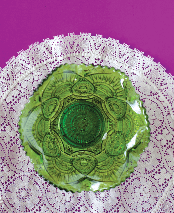 The intricate patterns on pieces such as this green carnival glass bowl made seemingly lavish home accents achievable for everyone.