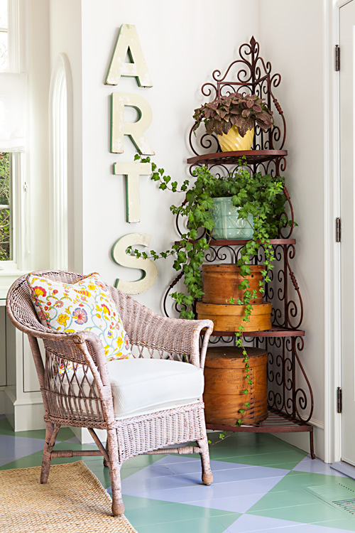 Wicker furniture and plenty of plants gives the interior of any beach cottage an outdoor feel.