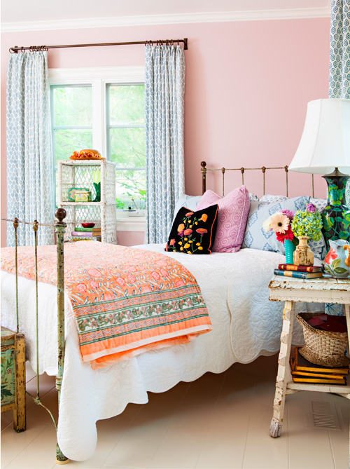 The hopeful colors and fun florals make this bedroom a place to recharge at the end of a long day.