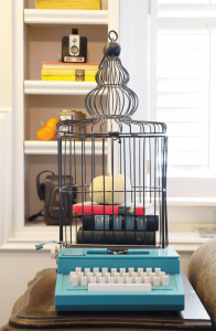 vintage fall decorating with typewriter and birdcage vignette with white pumpkin