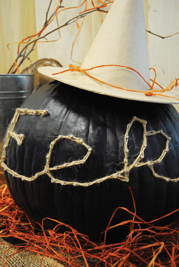 Create spooky sayings on your pumpkin using nails and twine.