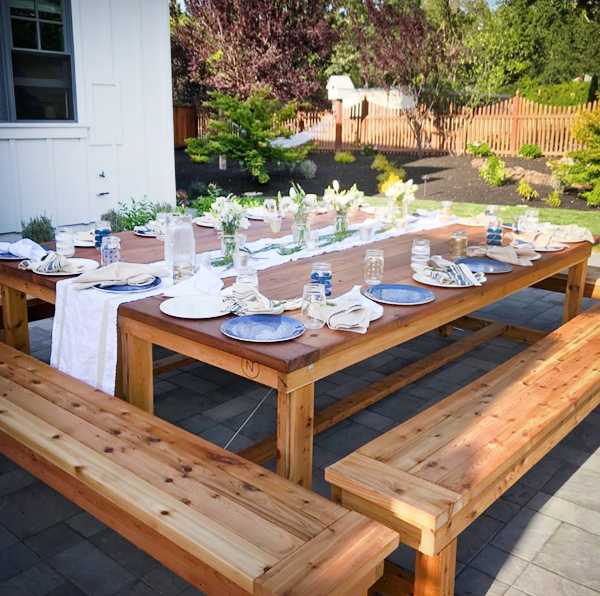 Large cedar table with matching wood benches.