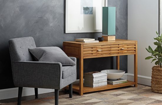 Add depth to gray rooms by using different shades of it—perhaps silver-gray walls with dark-gray furniture and accessories. Accessorize your room with the Tribeca Console, Angles Wool Rug, or Hues Mood Lamp from the Company Store, shown here.