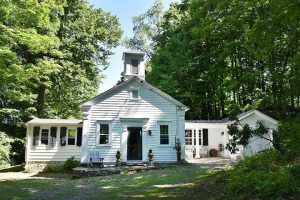 We love that the original silhouette is intact, including the historic steeple that was a telltale feature of a small school house from as late as the 1930s.