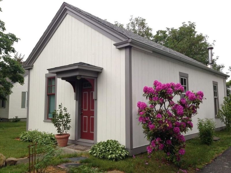 The architects of this former one-room school house took notes from Scandinavian style and modernized the interior while keeping their 1840s cottage exterior rather simple and untouched.