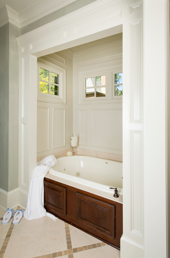 This master bathroom transformed into a showstopper with the addition of wainscoting surrounding the soaking tub.