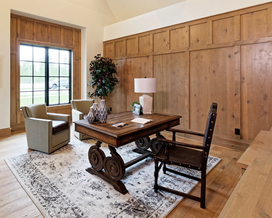 When designing this home office, the rest of the home’s style was taken into account, including the exposed ceiling beams.